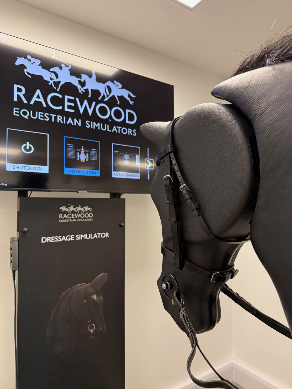 Closeup of horse simulator, head, bridle and training screen